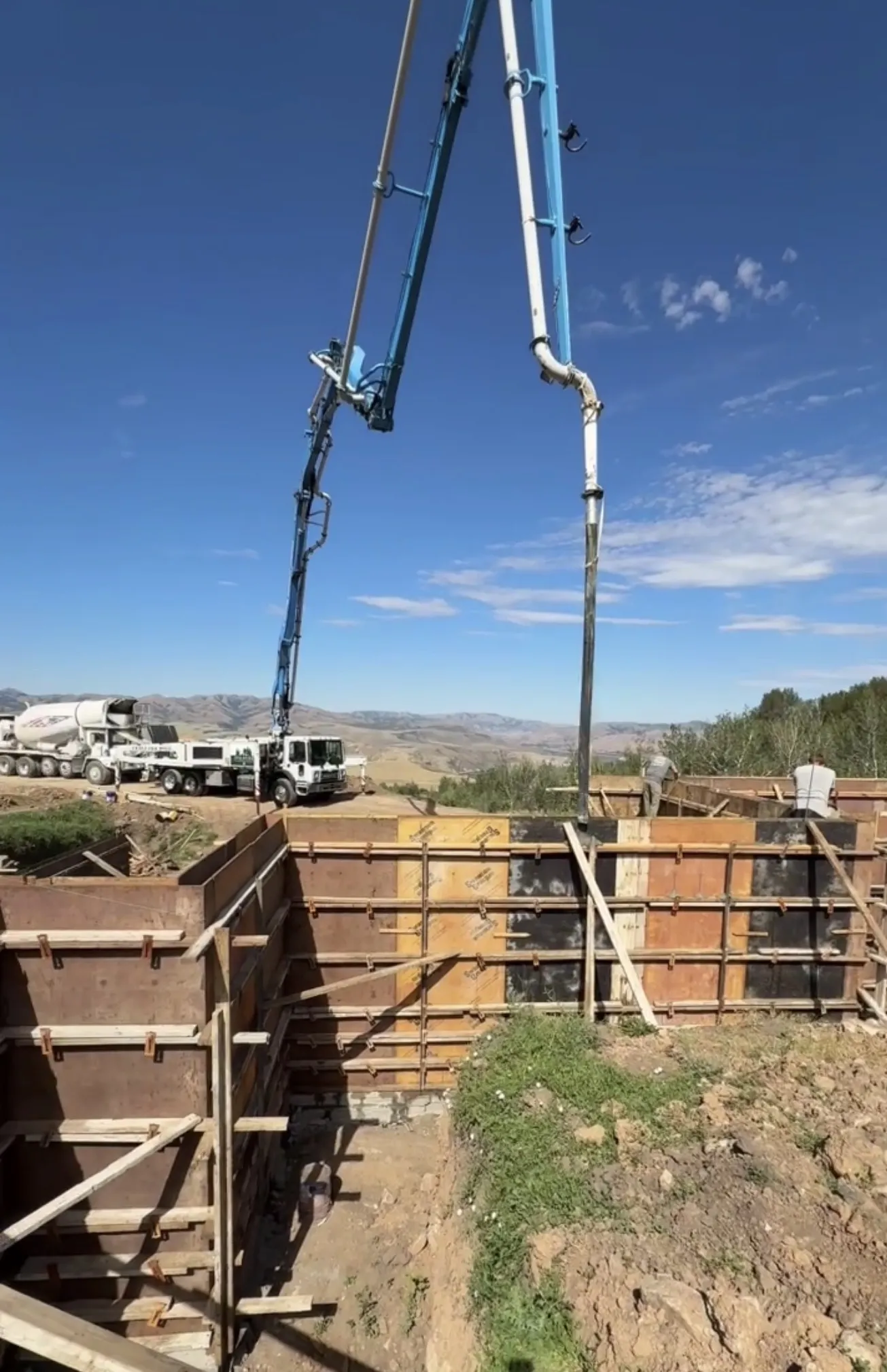 Concrete Boom Pump Ready for Your Next Footing or Foundation Pour image
